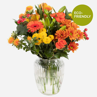 Orange Sky - A beautiful Autumn inspired vase of flowers. Filled with a burst of stunning orange, yellow and red blooms. Specially made and delivered by a professional florist. This is a gift that promises to leave a lasting impression. 
