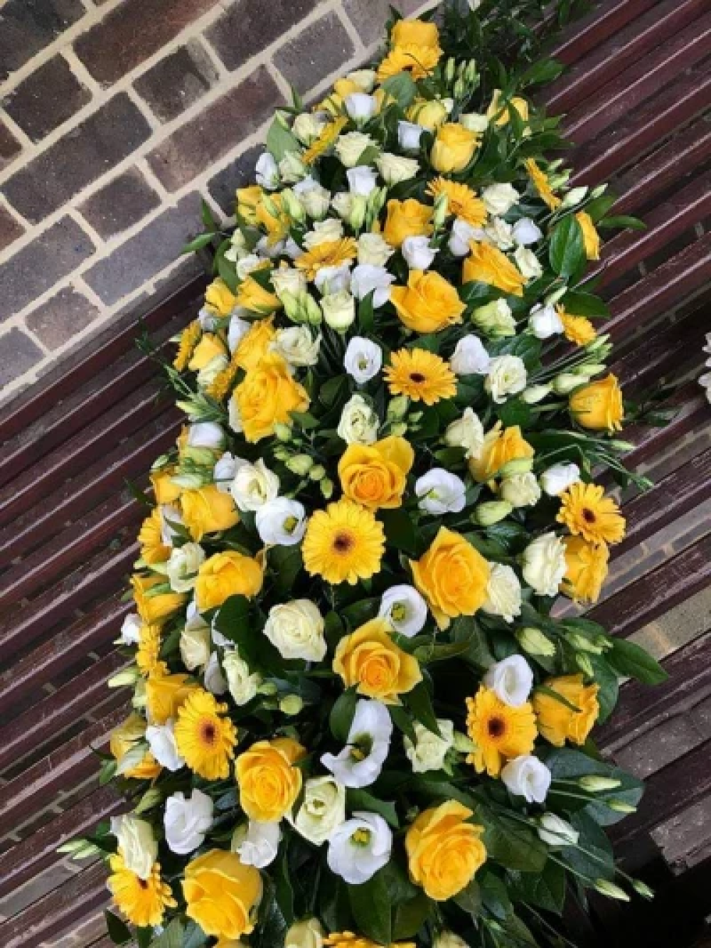 Yellow and white coffin spray