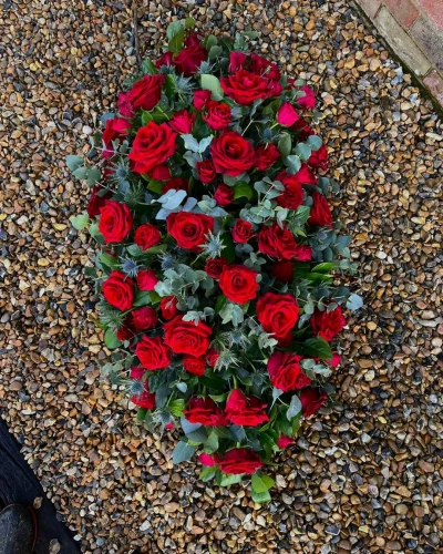 Red and blue coffin spray - <p>A beautiful striking red rose and blue thistle coffin spray&nbsp;</p>